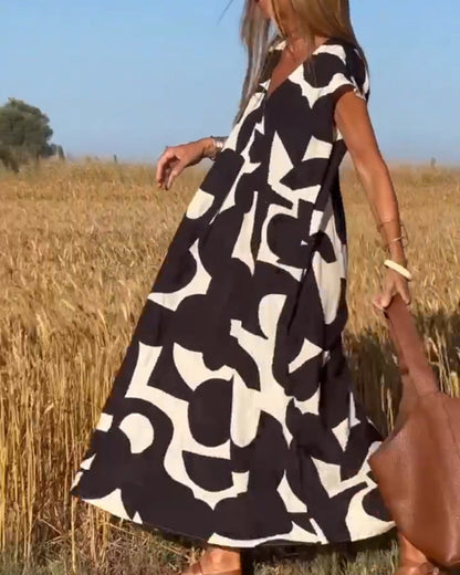 NAOMI | Long Printed Dress with V-Neck and Flared Fit for a Vacation Look