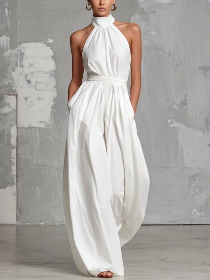 Elegant white woven jumpsuit, sleeveless, with halter neck