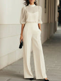 Three-piece set: sheer black tank top and wide-leg pants